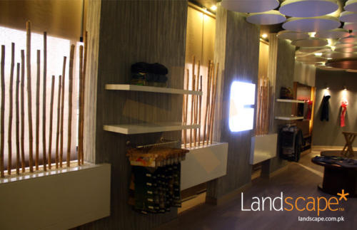 View-of-Texture-Walls-Racks-Filled-with-White-Marble-Crush-and-Bamboo-Sticks-to-Enhance-the-Interiors-of-the-Display-Area