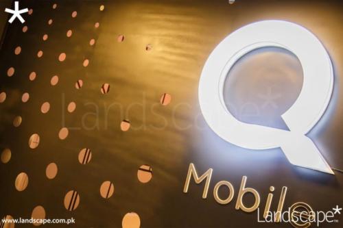 Mobile Factory s Reception Wall in Perforated Metal and Backlit Acrylic Logo
